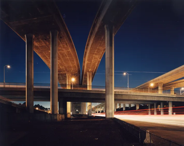 color photograph of I-105 at I-110, Transit Lanes, Los Angeles, at night.