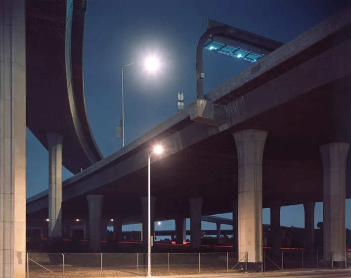 color photograph of I-405 at I-105, Overpass, Los Angeles, at night.