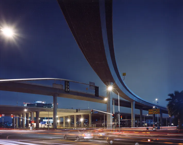 color photograph of I-405 at I-105, La Cienega Boulevard, Los Angeles, at night.