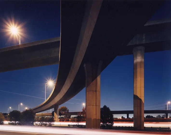 color photograph of I-710 at I-105, Overpass, Los Angeles, at night.